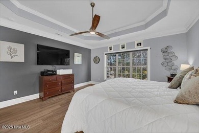 Experience luxury in this exquisite 3-bedroom, 3-bath all-brick on Cape Fear National At Brunswick Forest in North Carolina - for sale on GolfHomes.com, golf home, golf lot