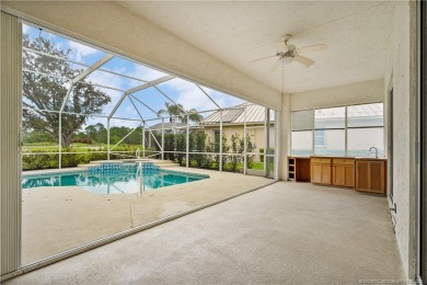 Step inside and fall in love with the view - a sparkling pool on Eagle Marsh Golf Club in Florida - for sale on GolfHomes.com, golf home, golf lot