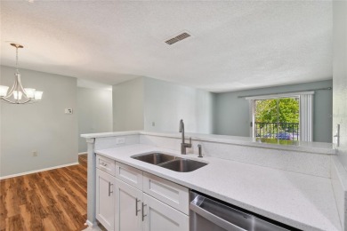 Spacious END UNIT with 3 bedrooms and 2 full bathrooms WITH A on Hunters Green Country Club in Florida - for sale on GolfHomes.com, golf home, golf lot