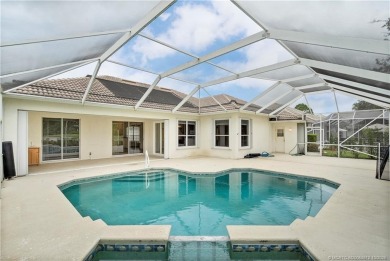 Step inside and fall in love with the view - a sparkling pool on Eagle Marsh Golf Club in Florida - for sale on GolfHomes.com, golf home, golf lot