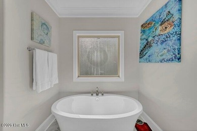 Experience luxury in this exquisite 3-bedroom, 3-bath all-brick on Cape Fear National At Brunswick Forest in North Carolina - for sale on GolfHomes.com, golf home, golf lot