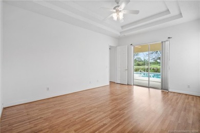 Step inside and fall in love with the view - a sparkling pool on Eagle Marsh Golf Club in Florida - for sale on GolfHomes.com, golf home, golf lot