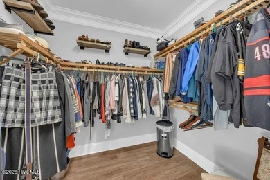 Experience luxury in this exquisite 3-bedroom, 3-bath all-brick on Cape Fear National At Brunswick Forest in North Carolina - for sale on GolfHomes.com, golf home, golf lot