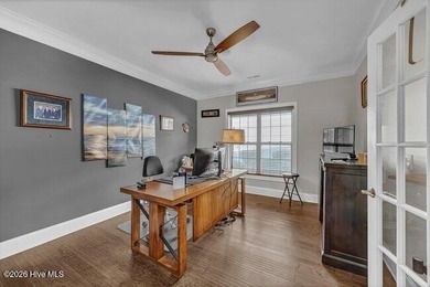 Experience luxury in this exquisite 3-bedroom, 3-bath all-brick on Cape Fear National At Brunswick Forest in North Carolina - for sale on GolfHomes.com, golf home, golf lot