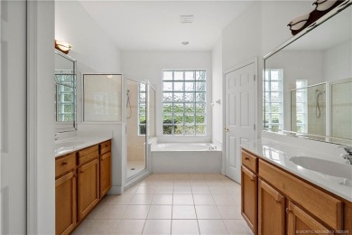 Step inside and fall in love with the view - a sparkling pool on Eagle Marsh Golf Club in Florida - for sale on GolfHomes.com, golf home, golf lot