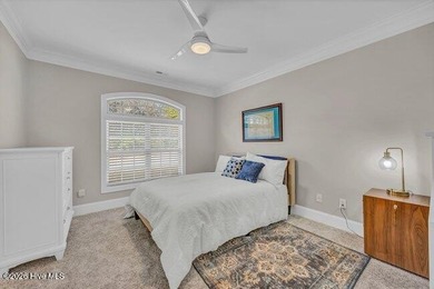 Experience luxury in this exquisite 3-bedroom, 3-bath all-brick on Cape Fear National At Brunswick Forest in North Carolina - for sale on GolfHomes.com, golf home, golf lot