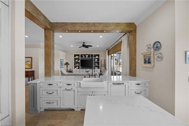 This stunning 2,748 sq. ft. three-bedroom plus den residence on Pelican Marsh Golf Club in Florida - for sale on GolfHomes.com, golf home, golf lot