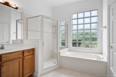 Step inside and fall in love with the view - a sparkling pool on Eagle Marsh Golf Club in Florida - for sale on GolfHomes.com, golf home, golf lot