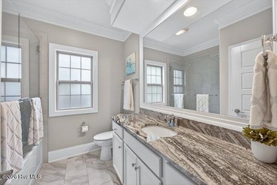 Experience luxury in this exquisite 3-bedroom, 3-bath all-brick on Cape Fear National At Brunswick Forest in North Carolina - for sale on GolfHomes.com, golf home, golf lot