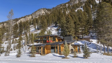 Step into this premier mountain modern home, perfectly sited on on Snake River Sporting Club in Wyoming - for sale on GolfHomes.com, golf home, golf lot