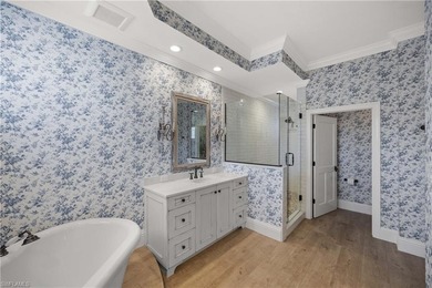 This stunning 2,748 sq. ft. three-bedroom plus den residence on Pelican Marsh Golf Club in Florida - for sale on GolfHomes.com, golf home, golf lot