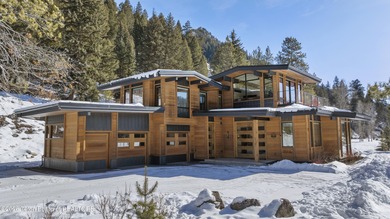 Step into this premier mountain modern home, perfectly sited on on Snake River Sporting Club in Wyoming - for sale on GolfHomes.com, golf home, golf lot