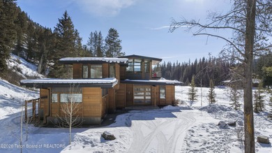 Step into this premier mountain modern home, perfectly sited on on Snake River Sporting Club in Wyoming - for sale on GolfHomes.com, golf home, golf lot
