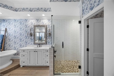 This stunning 2,748 sq. ft. three-bedroom plus den residence on Pelican Marsh Golf Club in Florida - for sale on GolfHomes.com, golf home, golf lot