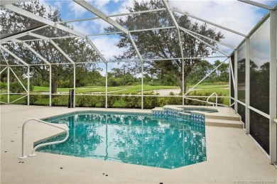 Step inside and fall in love with the view - a sparkling pool on Eagle Marsh Golf Club in Florida - for sale on GolfHomes.com, golf home, golf lot