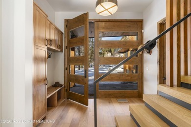 Step into this premier mountain modern home, perfectly sited on on Snake River Sporting Club in Wyoming - for sale on GolfHomes.com, golf home, golf lot