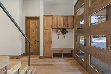 Step into this premier mountain modern home, perfectly sited on on Snake River Sporting Club in Wyoming - for sale on GolfHomes.com, golf home, golf lot