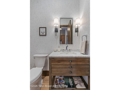 Step into this premier mountain modern home, perfectly sited on on Snake River Sporting Club in Wyoming - for sale on GolfHomes.com, golf home, golf lot