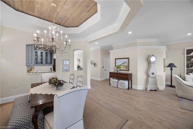 This stunning 2,748 sq. ft. three-bedroom plus den residence on Pelican Marsh Golf Club in Florida - for sale on GolfHomes.com, golf home, golf lot