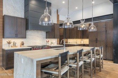 Step into this premier mountain modern home, perfectly sited on on Snake River Sporting Club in Wyoming - for sale on GolfHomes.com, golf home, golf lot