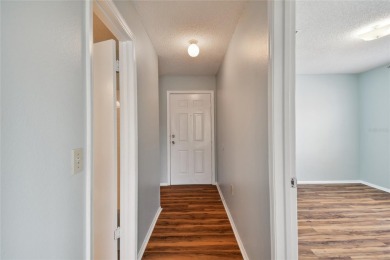 Spacious END UNIT with 3 bedrooms and 2 full bathrooms WITH A on Hunters Green Country Club in Florida - for sale on GolfHomes.com, golf home, golf lot