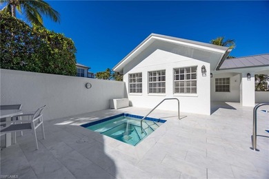 This stunning 2,748 sq. ft. three-bedroom plus den residence on Pelican Marsh Golf Club in Florida - for sale on GolfHomes.com, golf home, golf lot