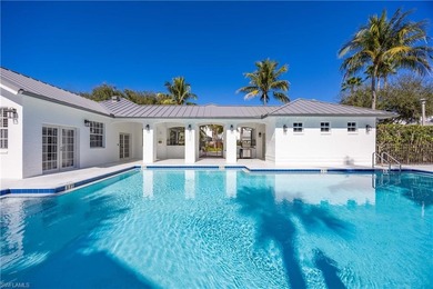 This stunning 2,748 sq. ft. three-bedroom plus den residence on Pelican Marsh Golf Club in Florida - for sale on GolfHomes.com, golf home, golf lot