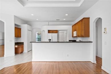 Step inside and fall in love with the view - a sparkling pool on Eagle Marsh Golf Club in Florida - for sale on GolfHomes.com, golf home, golf lot