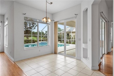 Step inside and fall in love with the view - a sparkling pool on Eagle Marsh Golf Club in Florida - for sale on GolfHomes.com, golf home, golf lot
