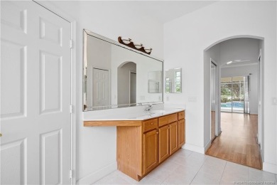 Step inside and fall in love with the view - a sparkling pool on Eagle Marsh Golf Club in Florida - for sale on GolfHomes.com, golf home, golf lot