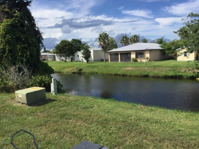 Great view from the kitchen and living room of this nicely on Spanish Lakes I in Florida - for sale on GolfHomes.com, golf home, golf lot