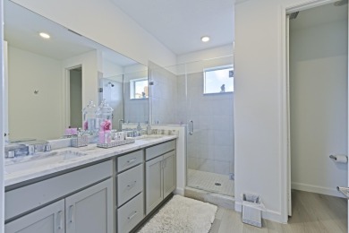 Stunning, move-in ready home with long lake views in the 55+ on Marina Lakes Golf Course in Florida - for sale on GolfHomes.com, golf home, golf lot