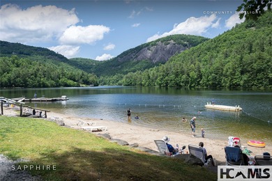 This prime building site offers potential mountain views of the on Sapphire National Golf Club in North Carolina - for sale on GolfHomes.com, golf home, golf lot