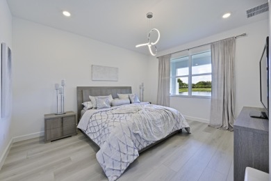 Stunning, move-in ready home with long lake views in the 55+ on Marina Lakes Golf Course in Florida - for sale on GolfHomes.com, golf home, golf lot