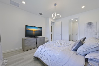 Stunning, move-in ready home with long lake views in the 55+ on Marina Lakes Golf Course in Florida - for sale on GolfHomes.com, golf home, golf lot