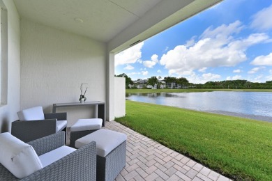 Stunning, move-in ready home with long lake views in the 55+ on Marina Lakes Golf Course in Florida - for sale on GolfHomes.com, golf home, golf lot