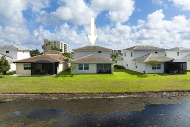 Stunning, move-in ready home with long lake views in the 55+ on Marina Lakes Golf Course in Florida - for sale on GolfHomes.com, golf home, golf lot