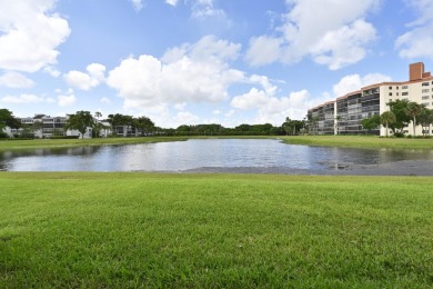Stunning, move-in ready home with long lake views in the 55+ on Marina Lakes Golf Course in Florida - for sale on GolfHomes.com, golf home, golf lot