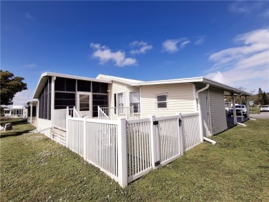 Just in time for your winter enjoyment! Sits by the 15th hole on on Barefoot Bay Golf Course in Florida - for sale on GolfHomes.com, golf home, golf lot