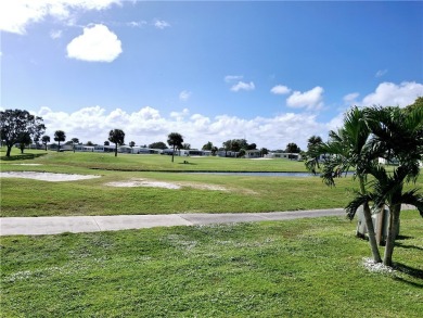 Just in time for your winter enjoyment! Sits by the 15th hole on on Barefoot Bay Golf Course in Florida - for sale on GolfHomes.com, golf home, golf lot