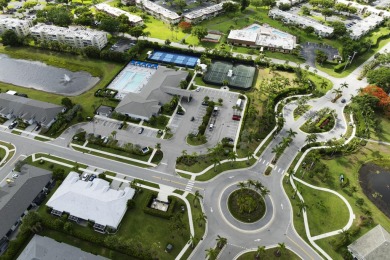 Stunning, move-in ready home with long lake views in the 55+ on Marina Lakes Golf Course in Florida - for sale on GolfHomes.com, golf home, golf lot