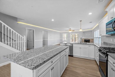 The Ridge plan! The primary suite, laundry, and living area fill on Woodfin Ridge Golf Club in South Carolina - for sale on GolfHomes.com, golf home, golf lot