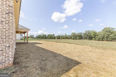 Open plan with beautiful golf course views. 4 bedrooms split on Southern Hills Golf Club in Georgia - for sale on GolfHomes.com, golf home, golf lot