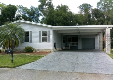 If you're searching for a beautiful, move-in ready home with on Hamptons Golf Club in Florida - for sale on GolfHomes.com, golf home, golf lot
