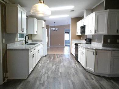 If you're searching for a beautiful, move-in ready home with on Hamptons Golf Club in Florida - for sale on GolfHomes.com, golf home, golf lot