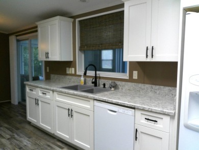 If you're searching for a beautiful, move-in ready home with on Hamptons Golf Club in Florida - for sale on GolfHomes.com, golf home, golf lot