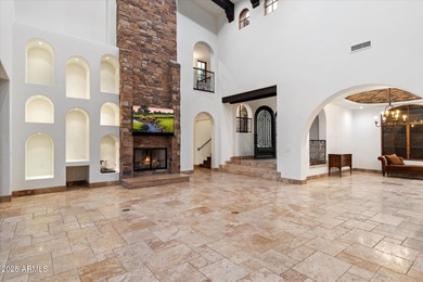 Private yet designed for grand-scale entertaining, this timeless on Eagle Mountain Golf Club in Arizona - for sale on GolfHomes.com, golf home, golf lot