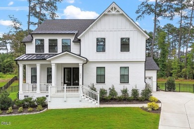 This beautifully designed and meticulously maintained on Hasentree Club in North Carolina - for sale on GolfHomes.com, golf home, golf lot