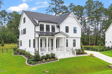 This beautifully designed and meticulously maintained on Hasentree Club in North Carolina - for sale on GolfHomes.com, golf home, golf lot
