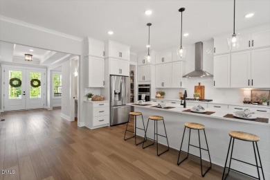 This beautifully designed and meticulously maintained on Hasentree Club in North Carolina - for sale on GolfHomes.com, golf home, golf lot